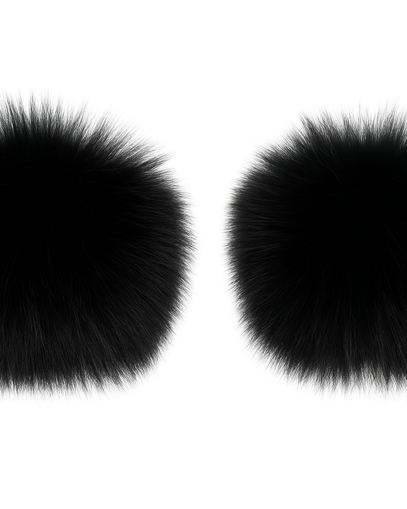 Two black fluffy faux fur wrist cuffs on a white background