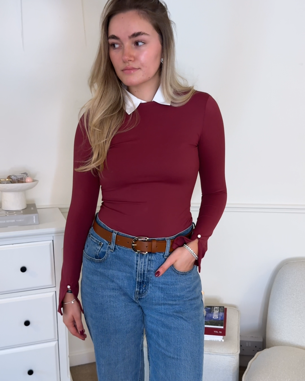 women wearing burgundy bodysuit and jeans outfit