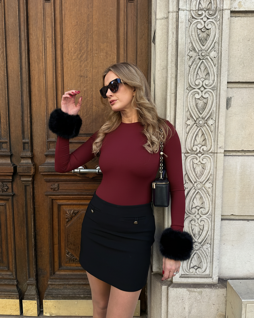 Woman in Ashly Rae bodysuit with Black faux fur cuffs