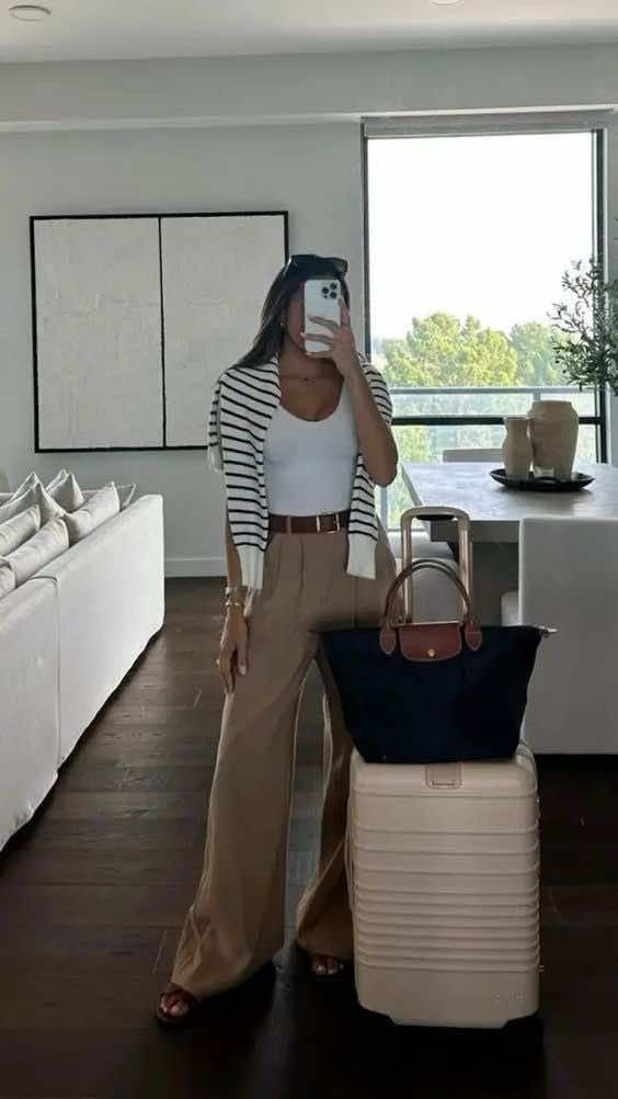 Founder Ashly Rae wearing elevated basics while packing for a stylish weekend away — the perfect mix of comfort, polish, and versatility