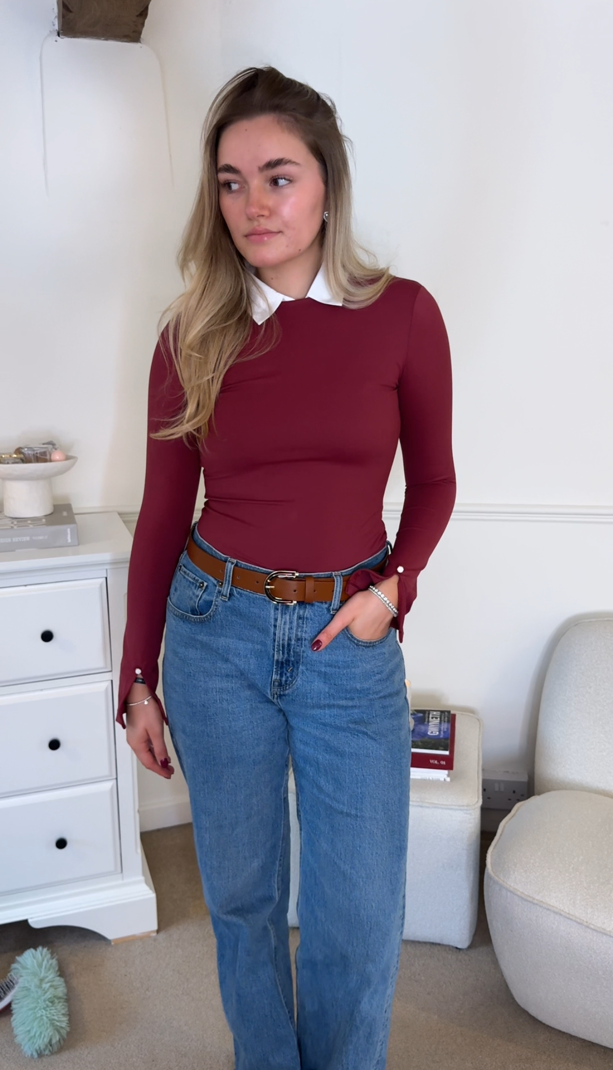 women wearing burgundy bodysuit and jeans outfit